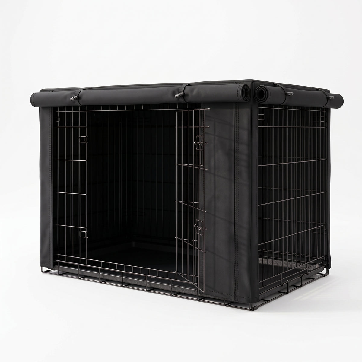 A black metal pet crate with a matching black fabric cover and roll-up top, shown on a clean white studio background.