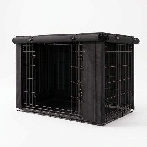 A black metal pet crate with a matching black fabric cover and roll-up top, shown on a clean white studio background.