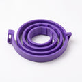A purple coiled plastic strap or band with small side tabs, photographed on a clean white background.