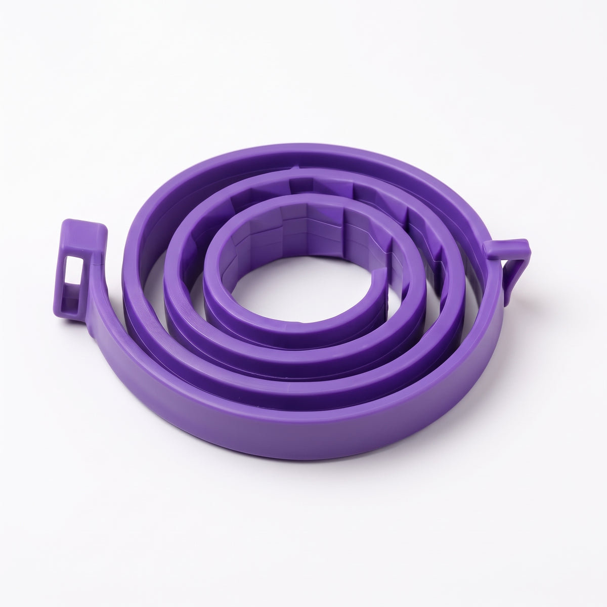 A purple coiled plastic strap or band with small side tabs, photographed on a clean white background.