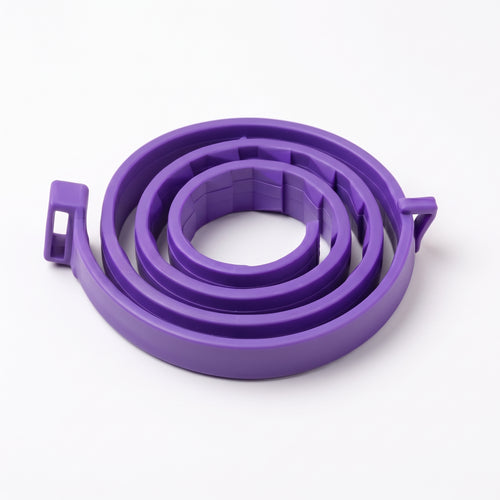 A purple coiled plastic strap or band with small side tabs, photographed on a clean white background.